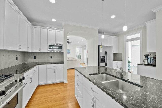 100 Maywood Way, Chapel Hill, NC 27516 - kitchen with appliances with stainless steel finishes, crown molding, a sink, white cabinetry, and tasteful backsplash