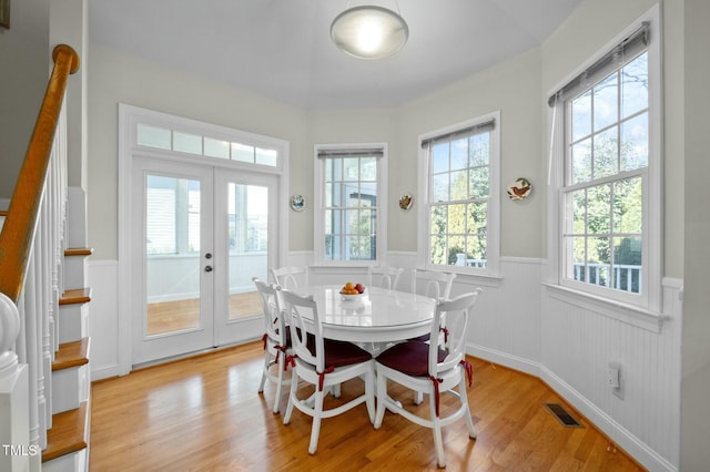 100 Maywood Way, Chapel Hill, NC 27516 - dining area featuring a wainscoted wall, french doors, and light wood-style flooring
