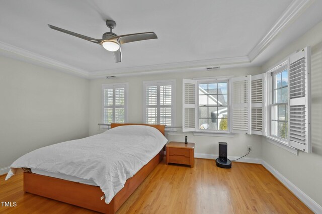 100 Maywood Way, Chapel Hill, NC 27516 - bedroom with light wood-type flooring, multiple windows, crown molding, and baseboards