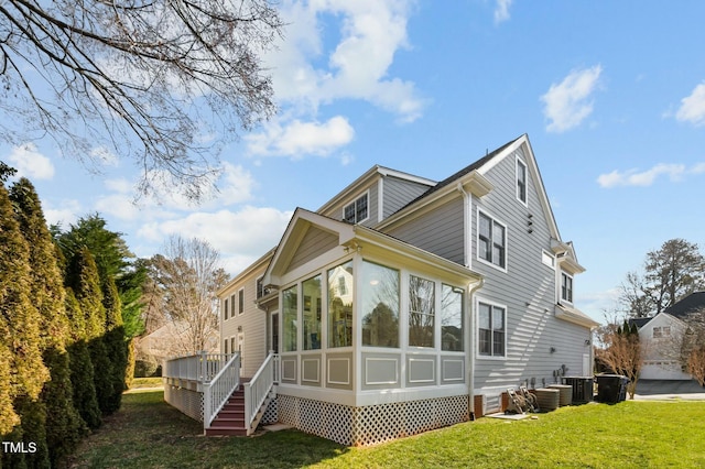 100 Maywood Way, Chapel Hill, NC 27516 - rear view of property featuring a sunroom, a yard, and cooling unit