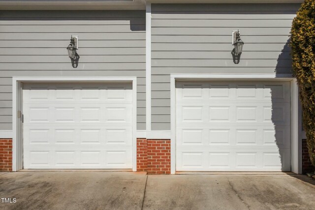 100 Maywood Way, Chapel Hill, NC 27516 - garage featuring concrete driveway