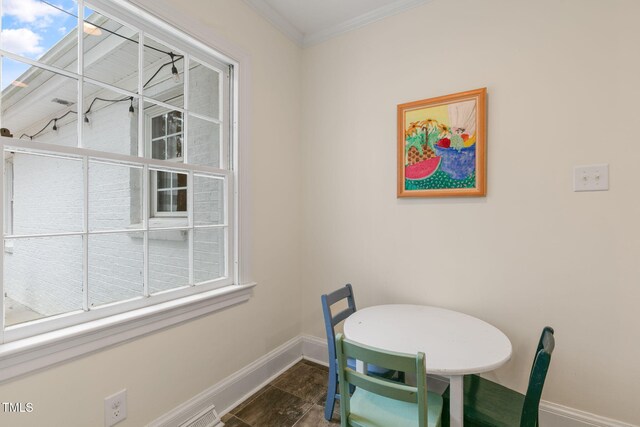 1115 Laurel Ln NW, Wilson, NC 27896 - dining area with baseboards and crown molding