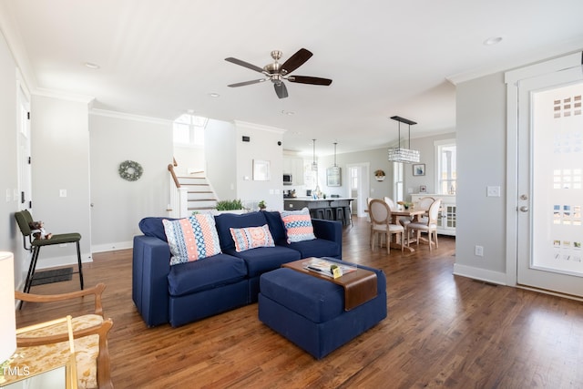 595 E Cabarrus St, Raleigh, NC 27601 - living room with stairs, a ceiling fan, ornamental molding, wood finished floors, and recessed lighting