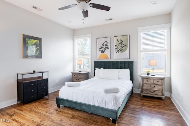 595 E Cabarrus St, Raleigh, NC 27601 - bedroom with wood finished floors, baseboards, and ceiling fan