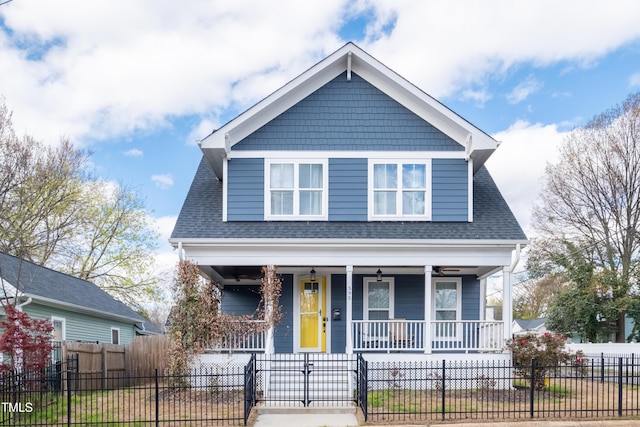 595 E Cabarrus St, Raleigh, NC 27601 - view of front of home featuring a porch, roof with shingles, a fenced front yard, and a gate
