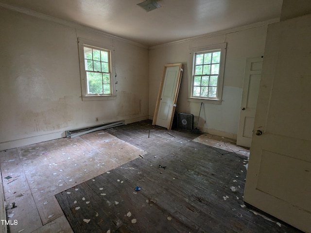 207 Bruton St W, Wilson, NC 27893 - empty room featuring a baseboard radiator, crown molding, hardwood / wood-style flooring, and baseboards