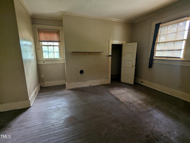 207 Bruton St W, Wilson, NC 27893 - unfurnished bedroom featuring ornamental molding, baseboards, and hardwood / wood-style flooring