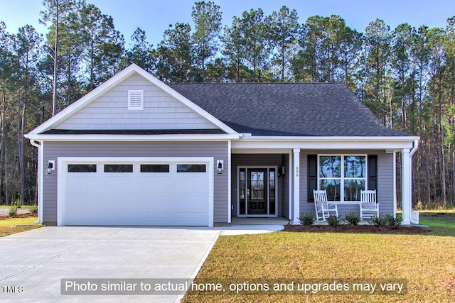 1998 Meadowview Dr, Graham, NC 27253 - view of front of property with a porch, an attached garage, concrete driveway, and a front yard