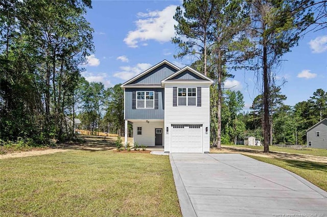 3242 June Johnson Rd, Raeford, NC 28376 - view of front facade with driveway, an attached garage, and a front yard
