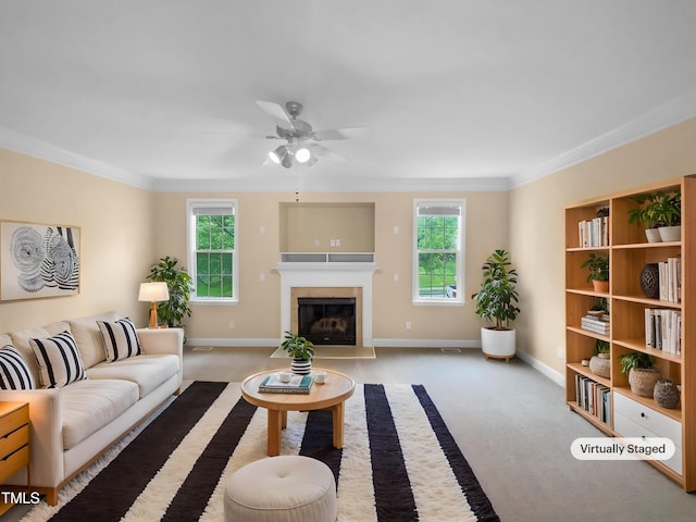 3116 Kirby St, Durham, NC 27713 - carpeted living area featuring ceiling fan, crown molding, baseboards, and a fireplace with flush hearth