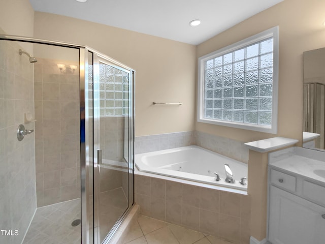 3116 Kirby St, Durham, NC 27713 - full bath featuring a shower stall, a jetted tub, vanity, and tile patterned flooring