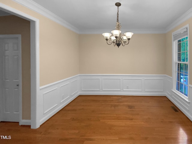 3116 Kirby St, Durham, NC 27713 - spare room with ornamental molding, a chandelier, light wood-style flooring, and wainscoting