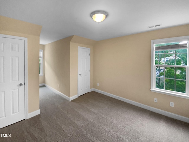 3116 Kirby St, Durham, NC 27713 - unfurnished room with dark carpet and baseboards