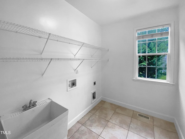 3116 Kirby St, Durham, NC 27713 - washroom featuring hookup for an electric dryer, baseboards, washer hookup, and light tile patterned floors