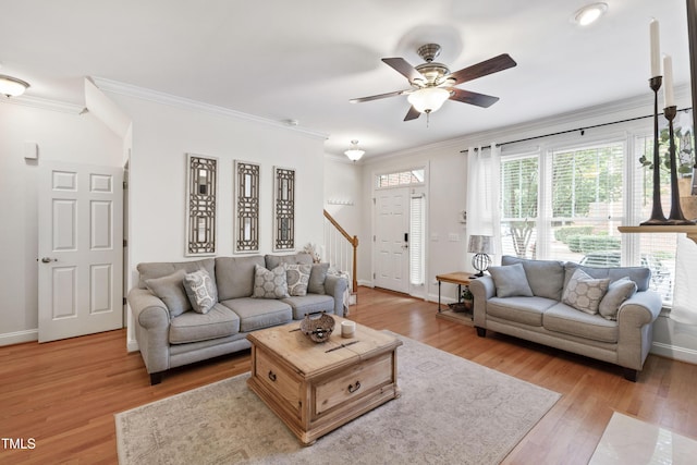 222 Ashton Hall Ln, Raleigh, NC 27609 - living room with stairway, crown molding, ceiling fan, baseboards, and light wood finished floors