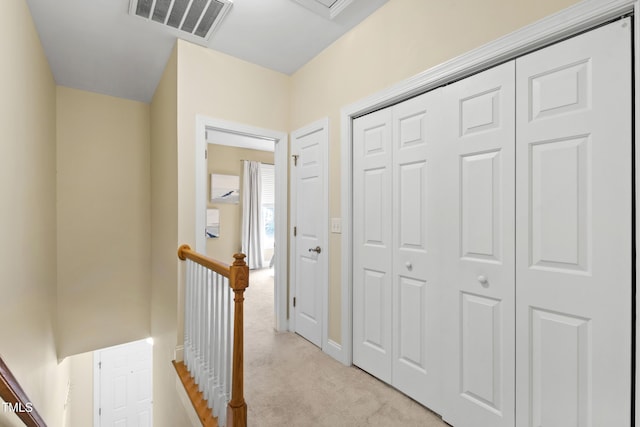 222 Ashton Hall Ln, Raleigh, NC 27609 - corridor with light colored carpet, an upstairs landing, and baseboards