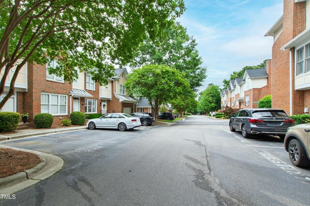 222 Ashton Hall Ln, Raleigh, NC 27609 - view of asphalt road with a residential view and curbs