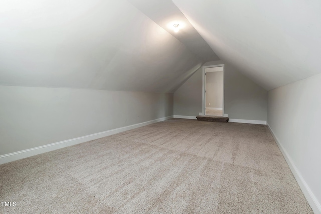 550 Spring Flowers Dr, Cameron, NC 28326 - additional living space with carpet flooring, lofted ceiling, and baseboards