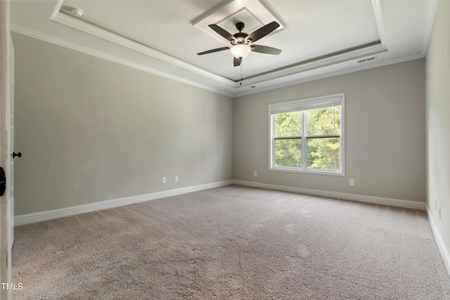 550 Spring Flowers Dr, Cameron, NC 28326 - spare room with a tray ceiling, crown molding, a ceiling fan, carpet flooring, and baseboards