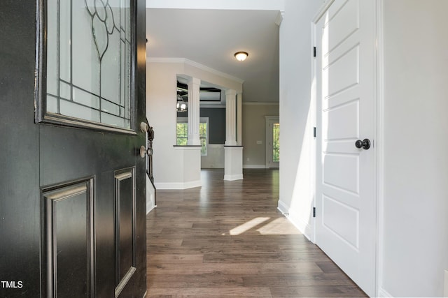 550 Spring Flowers Dr, Cameron, NC 28326 - entrance foyer with crown molding, dark wood finished floors, baseboards, and ornate columns