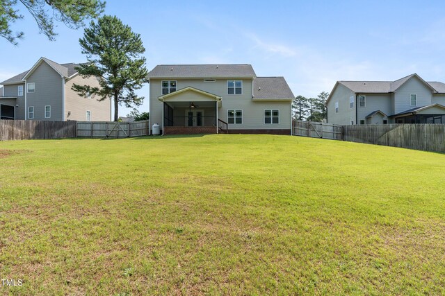 550 Spring Flowers Dr, Cameron, NC 28326 - rear view of property with ceiling fan and a sunroom