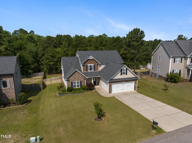 550 Spring Flowers Dr, Cameron, NC 28326 - view of front facade with concrete driveway, an attached garage, brick siding, a forest view, and roof with shingles