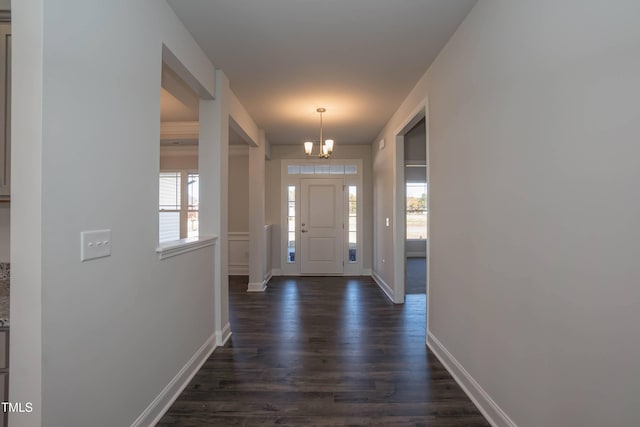 61 Merrifield Ln, Garner, NC 27529 - entrance foyer with a chandelier, baseboards, and dark wood-style floors