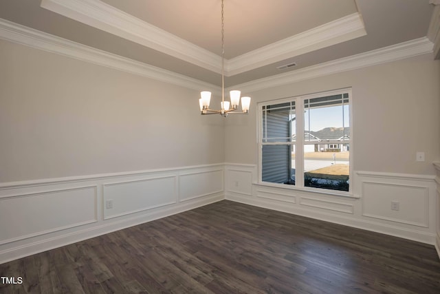 61 Merrifield Ln, Garner, NC 27529 - unfurnished room with a tray ceiling, a chandelier, dark wood finished floors, a wainscoted wall, and a decorative wall