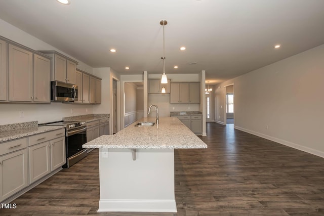 61 Merrifield Ln, Garner, NC 27529 - kitchen featuring stainless steel appliances, a sink, gray cabinets, recessed lighting, and dark wood-style flooring