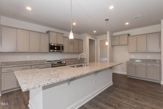 61 Merrifield Ln, Garner, NC 27529 - kitchen with a sink, stainless steel appliances, gray cabinets, dark wood finished floors, and baseboards