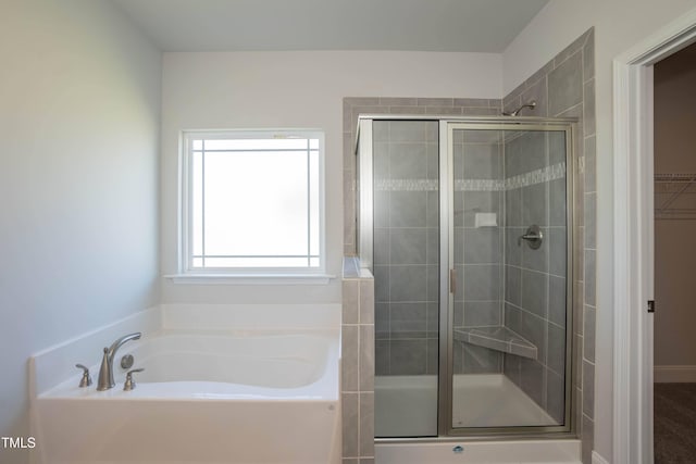 61 Merrifield Ln, Garner, NC 27529 - bathroom with a shower stall, a bath, and a spacious closet