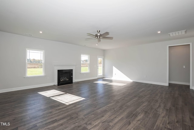 61 Merrifield Ln, Garner, NC 27529 - unfurnished living room featuring a ceiling fan, a fireplace with flush hearth, baseboards, dark wood-type flooring, and recessed lighting