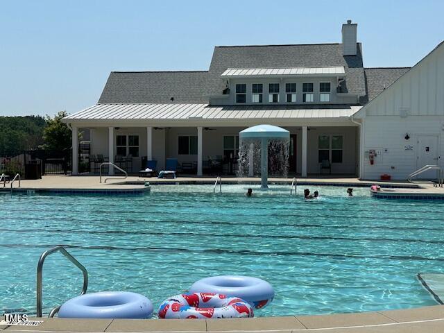 61 Merrifield Ln, Garner, NC 27529 - community pool featuring a patio
