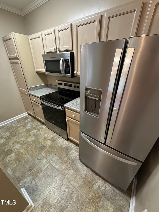 710 N Person St Unit 103, Raleigh, NC 27604 - kitchen with stainless steel appliances, crown molding, stone finish floors, baseboards, and light brown cabinets