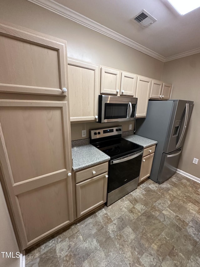 710 N Person St Unit 103, Raleigh, NC 27604 - kitchen with appliances with stainless steel finishes, crown molding, baseboards, stone finish floors, and light countertops
