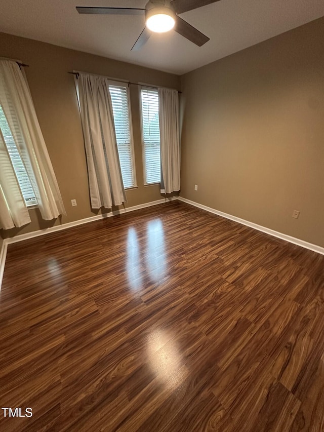 710 N Person St Unit 103, Raleigh, NC 27604 - spare room with ceiling fan, dark wood finished floors, and baseboards