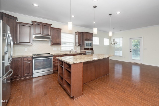 826 Downfield Ln, Fuquay Varina, NC 27526 - kitchen featuring appliances with stainless steel finishes, under cabinet range hood, open shelves, a center island, and dark wood-style flooring