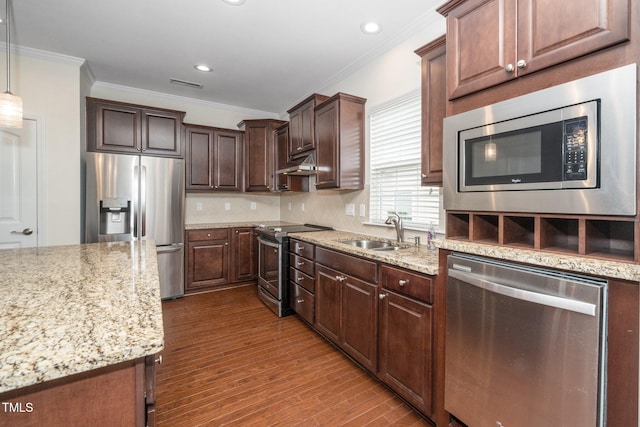 826 Downfield Ln, Fuquay Varina, NC 27526 - kitchen featuring appliances with stainless steel finishes, a sink, crown molding, under cabinet range hood, and light stone counters