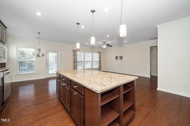 826 Downfield Ln, Fuquay Varina, NC 27526 - kitchen featuring ornamental molding, a chandelier, dark wood-style floors, plenty of natural light, and recessed lighting