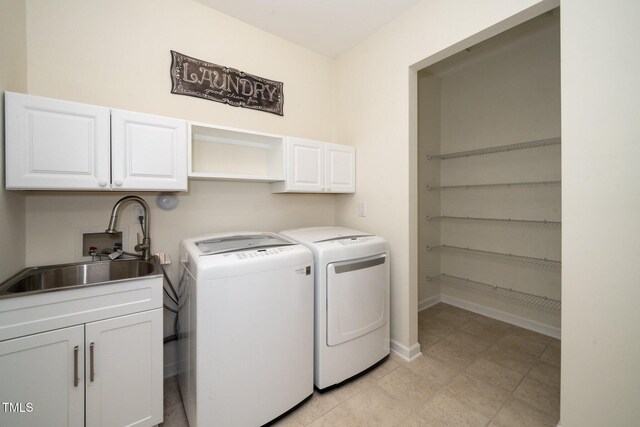 826 Downfield Ln, Fuquay Varina, NC 27526 - laundry room featuring cabinet space, washing machine and dryer, and baseboards