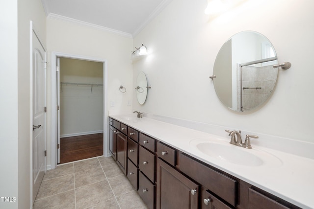 826 Downfield Ln, Fuquay Varina, NC 27526 - full bath featuring ornamental molding, double vanity, tile patterned flooring, a walk in closet, and baseboards