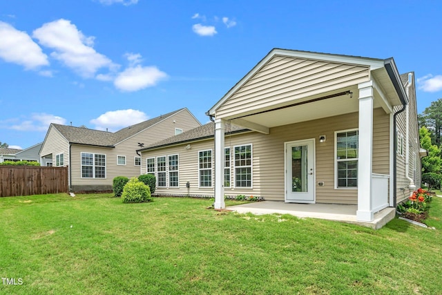 826 Downfield Ln, Fuquay Varina, NC 27526 - rear view of house with a patio area