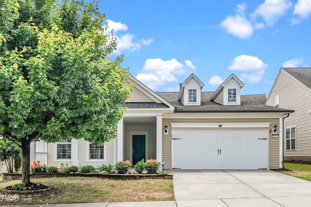 826 Downfield Ln, Fuquay Varina, NC 27526 - view of front of property featuring driveway, a garage, board and batten siding, and a shingled roof