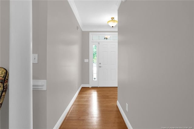 3207 Notting Hill Rd, Fayetteville, NC 28311 - foyer featuring crown molding, light wood finished floors, and baseboards