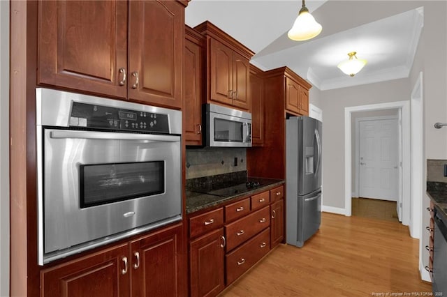3207 Notting Hill Rd, Fayetteville, NC 28311 - kitchen with appliances with stainless steel finishes, ornamental molding, dark stone countertops, tasteful backsplash, and light wood-style flooring