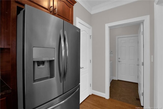 3207 Notting Hill Rd, Fayetteville, NC 28311 - kitchen with stainless steel fridge, ornamental molding, light wood-style floors, baseboards, and brown cabinetry