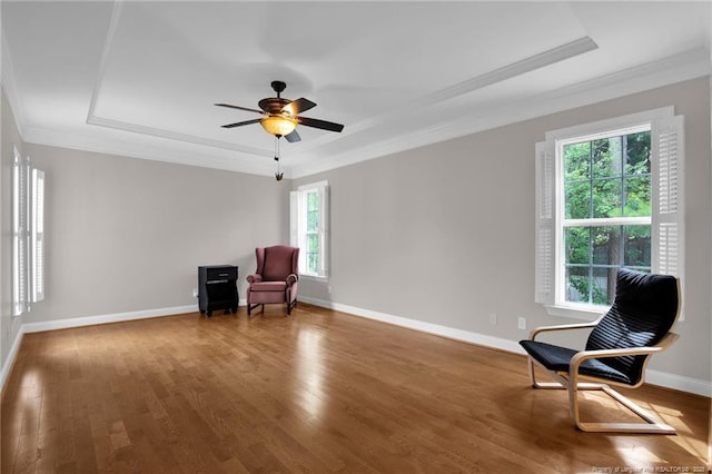 3207 Notting Hill Rd, Fayetteville, NC 28311 - sitting room featuring a tray ceiling, crown molding, wood finished floors, ceiling fan, and baseboards