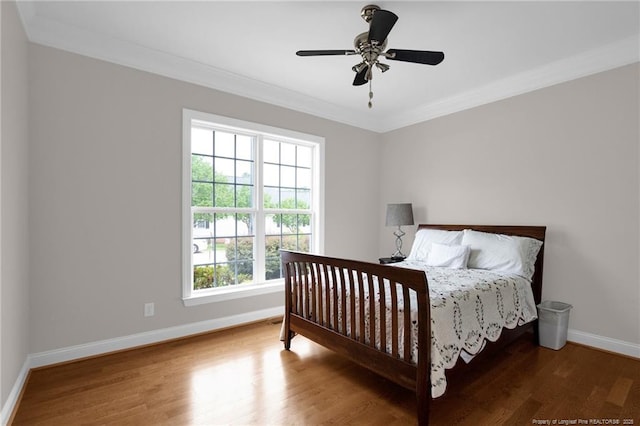 3207 Notting Hill Rd, Fayetteville, NC 28311 - bedroom featuring baseboards, ornamental molding, wood finished floors, and ceiling fan