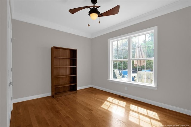 3207 Notting Hill Rd, Fayetteville, NC 28311 - unfurnished room with wood finished floors, ornamental molding, baseboards, and a ceiling fan