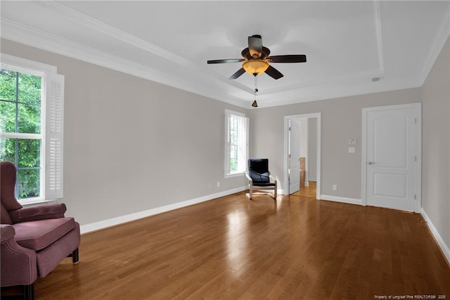 3207 Notting Hill Rd, Fayetteville, NC 28311 - unfurnished room featuring a tray ceiling, wood finished floors, a ceiling fan, baseboards, and crown molding